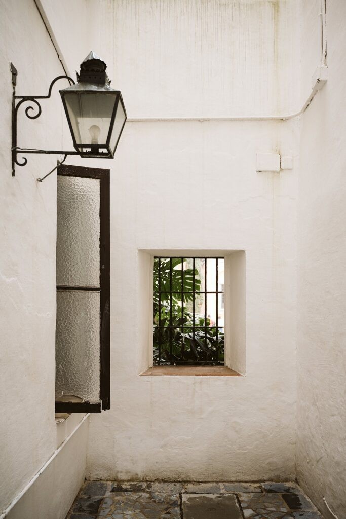 Small white courtyard in Royal Alcazar in Seville, Spain