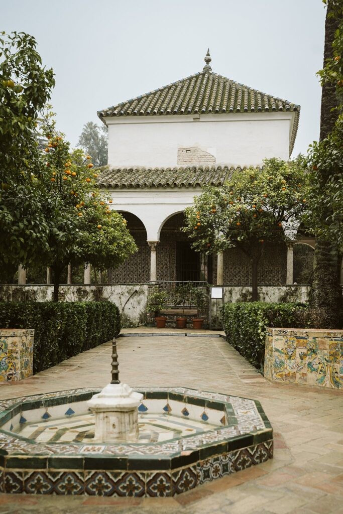 fountain in Royal Alcazar gardens in Seville, Spain