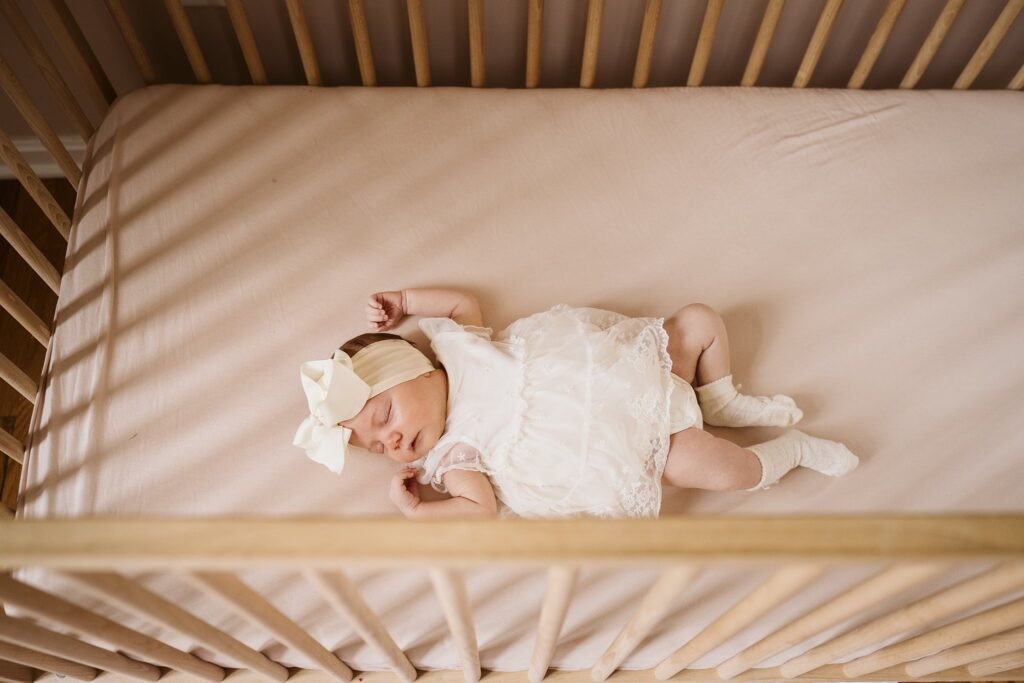 newborn sleeping in crib