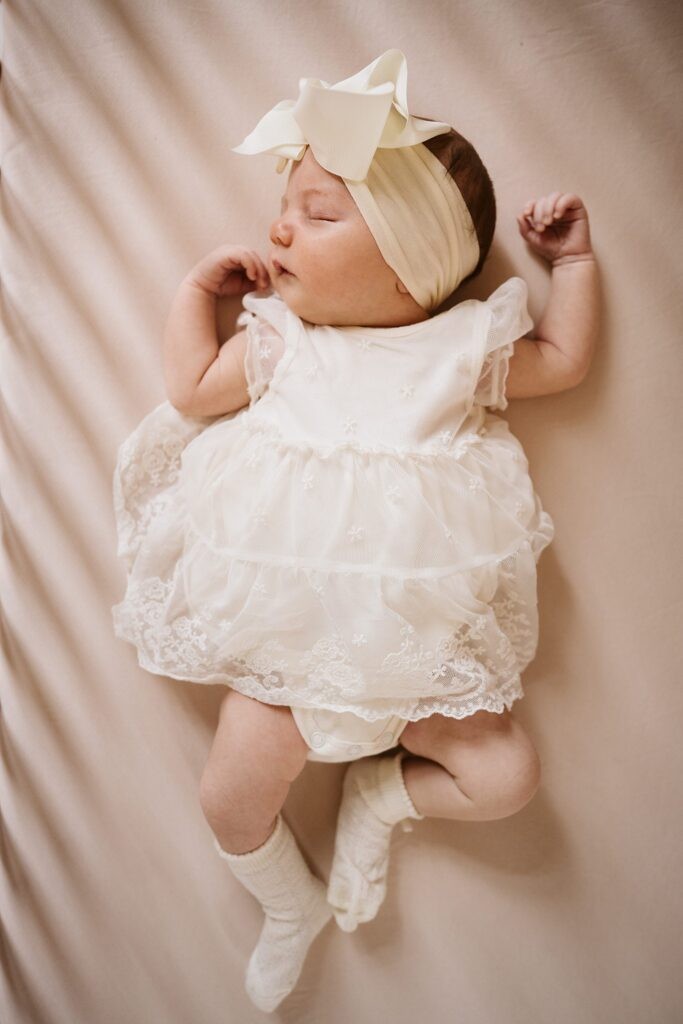 newborn sleeping in crib