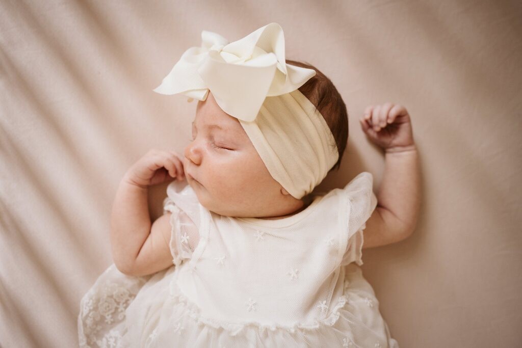 newborn sleeping in crib