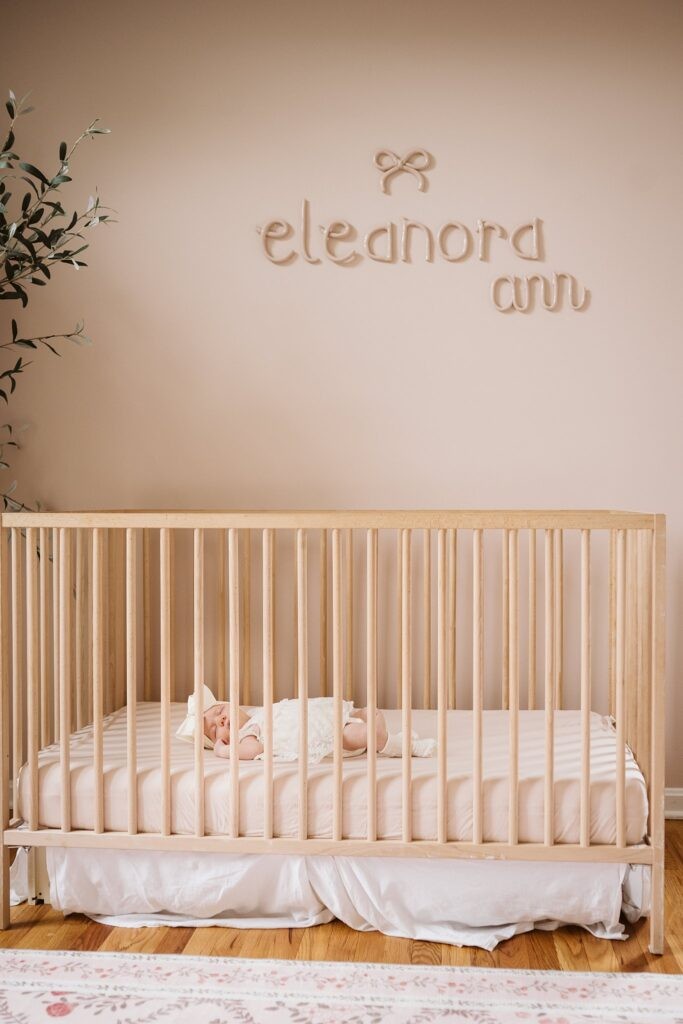 newborn sleeping in crib