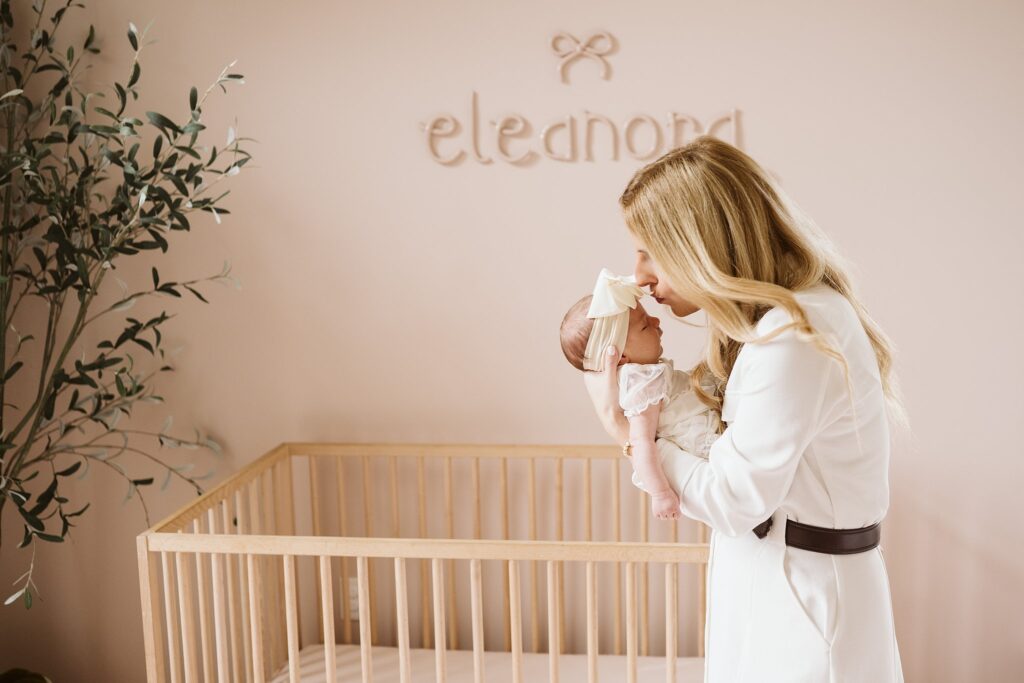 mom holding newborn lifestyle portrait