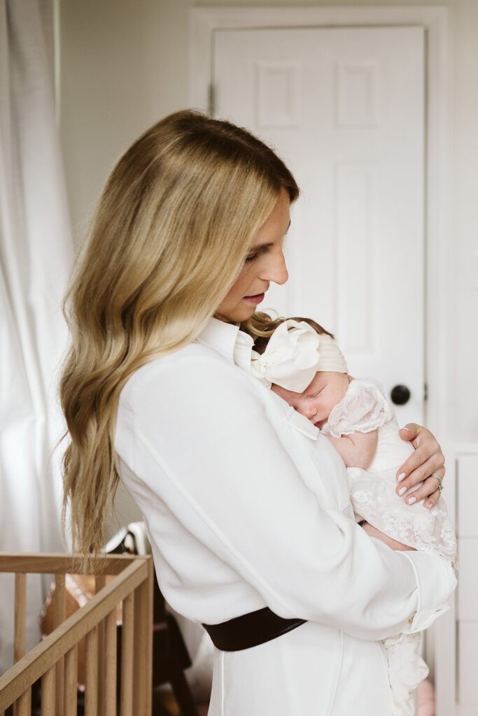 mom holding newborn lifestyle portrait