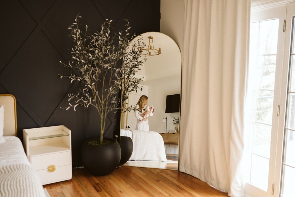 mother and newborn lifestyle portrait with reflection in mirror