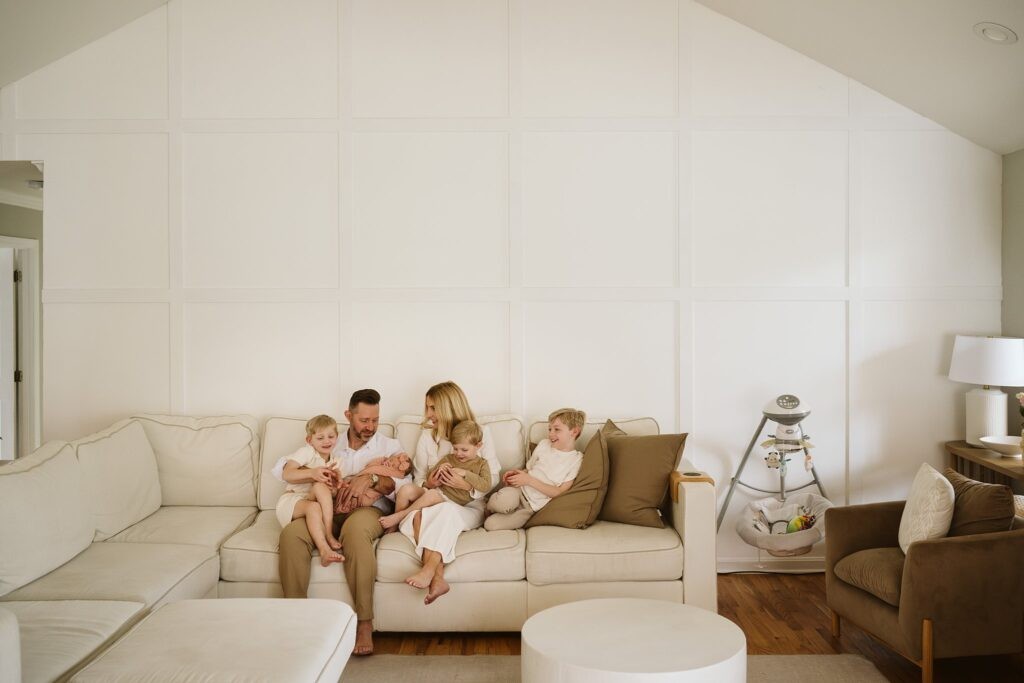 family in living room during newborn lifestyle session