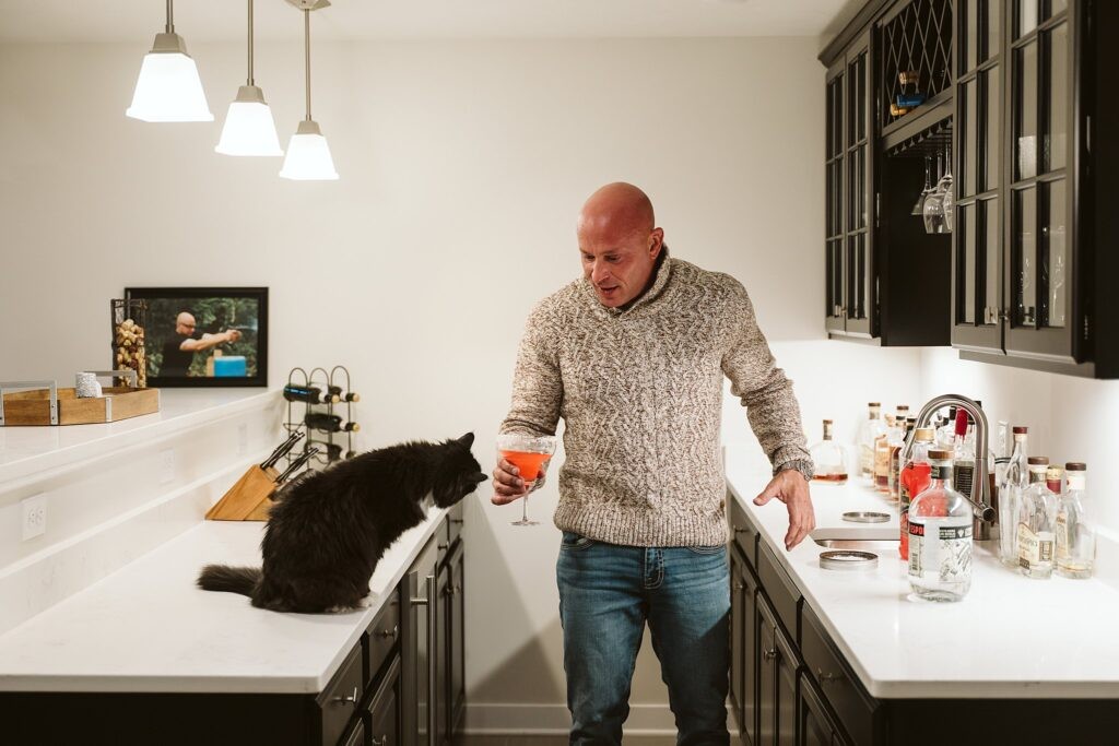 editorial portrait of man making a drink