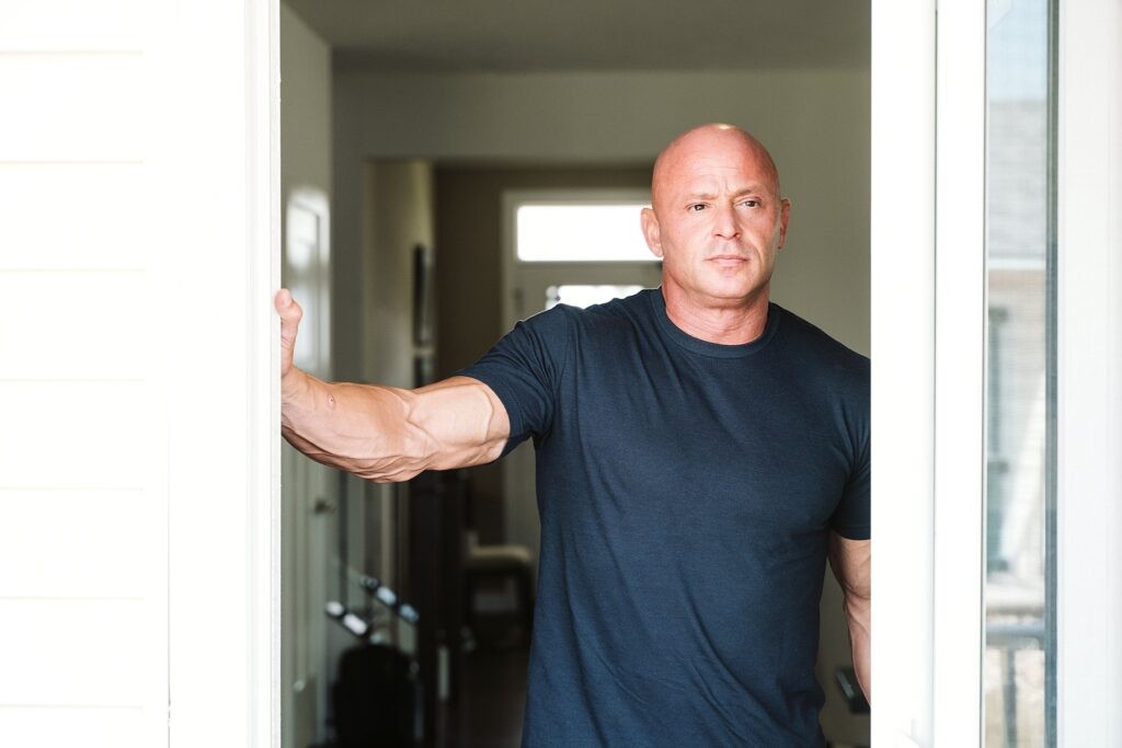 editorial portrait of man at door