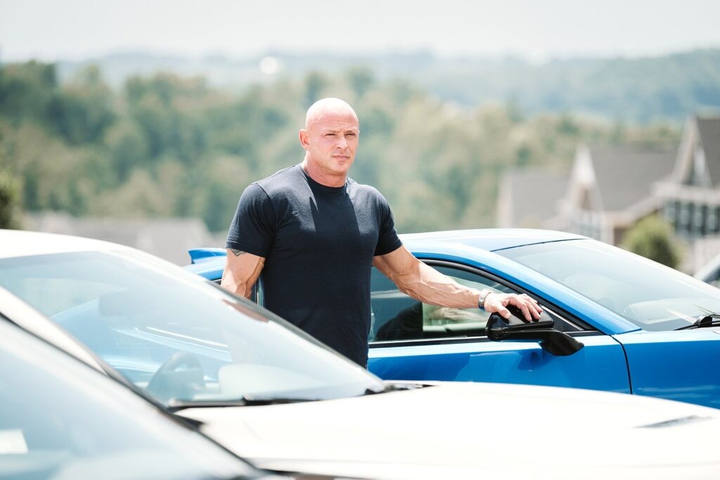 editorial portrait of man at car