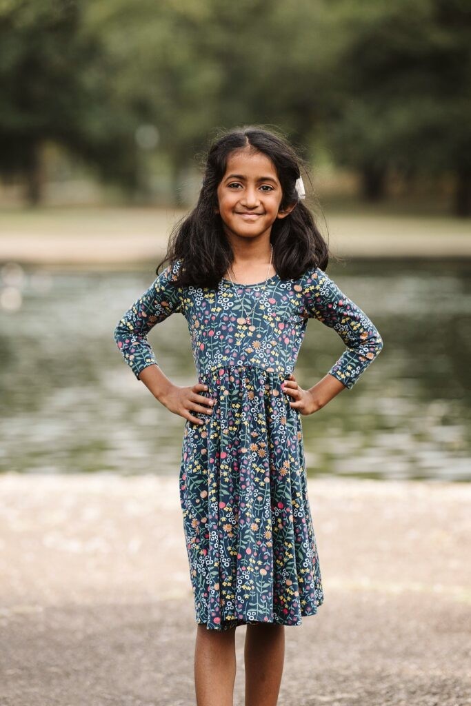 siblings playing together during family photoshoot