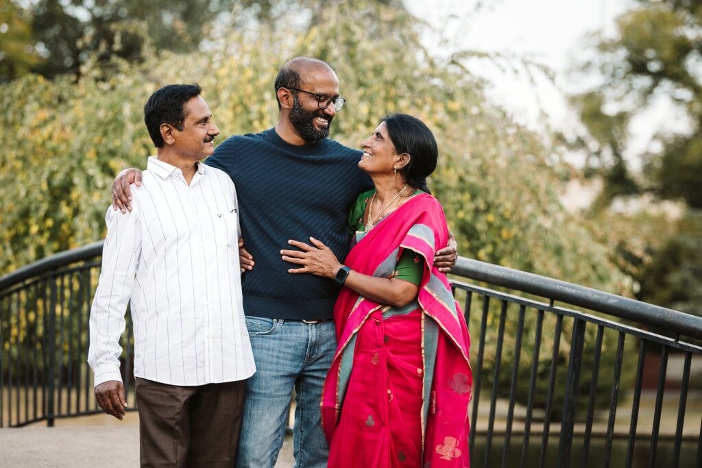 parents photographed with adult son