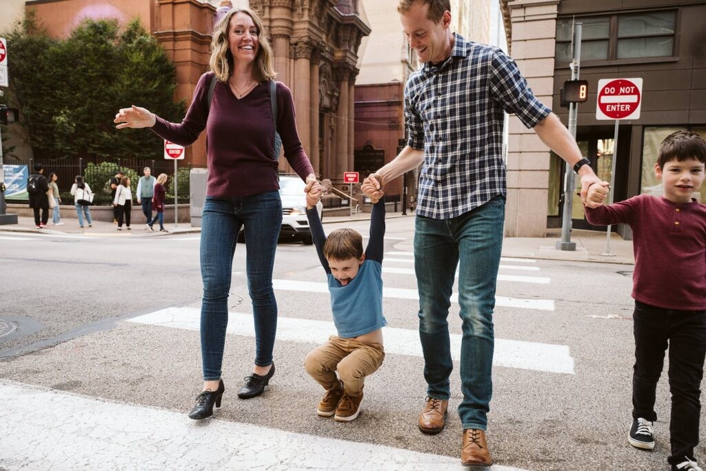 Family exploring downtown Pittsburgh together during lifestyle photoshoot