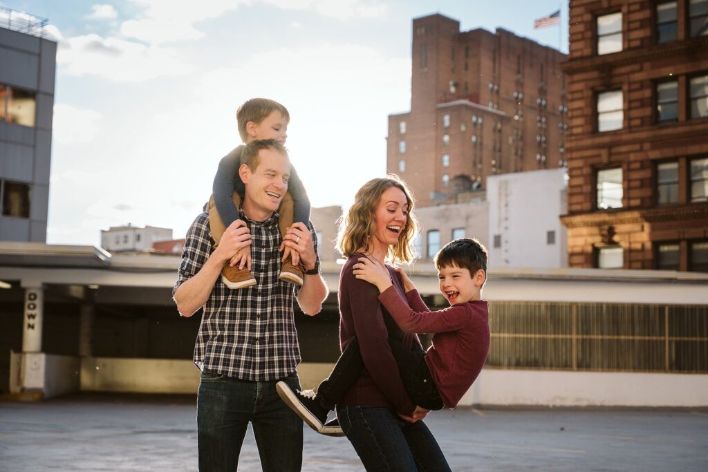family playing together for photoshoot in Pittsburgh