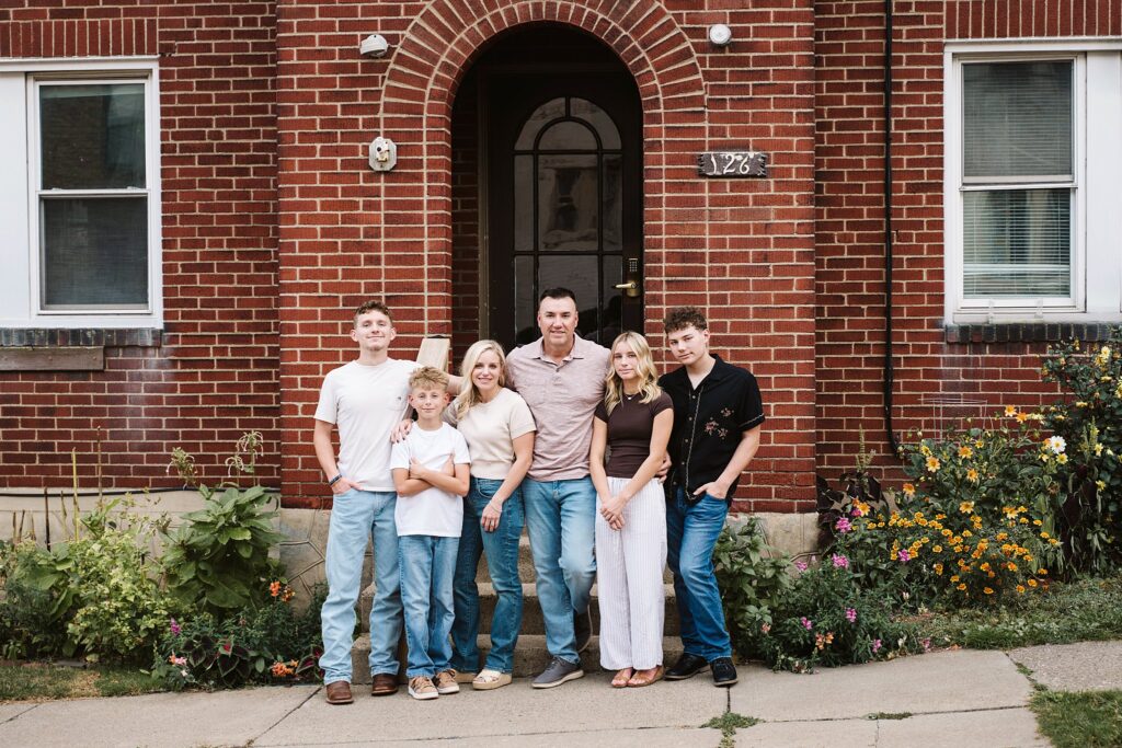 portrait of family in front of brick porch in Mt. Lebanon, PA