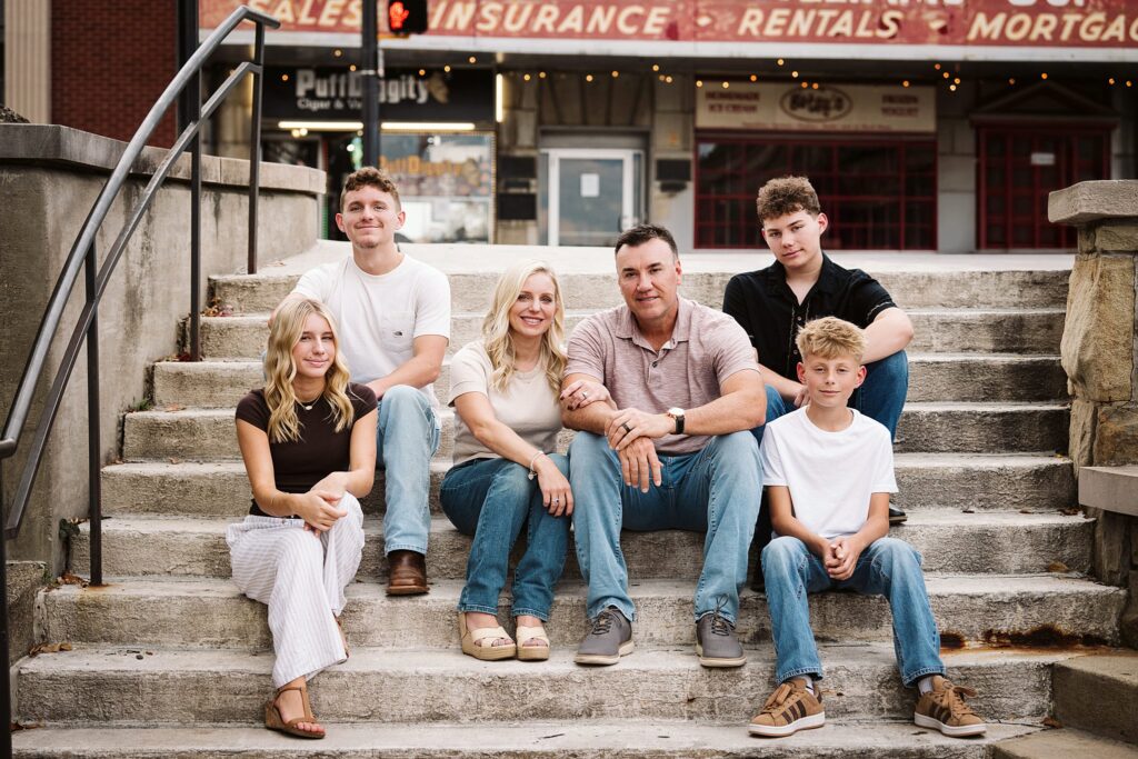 portrait of family sitting on steps in Mt. Lebanon