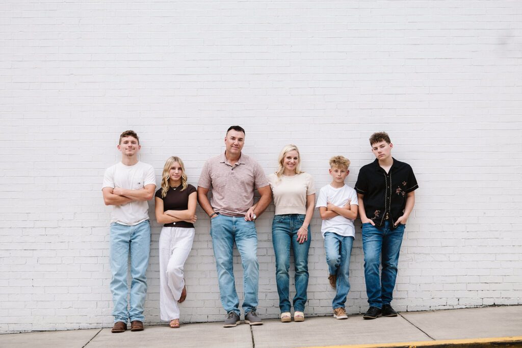 portrait of family near brick wall in Mt. Lebanon, PA