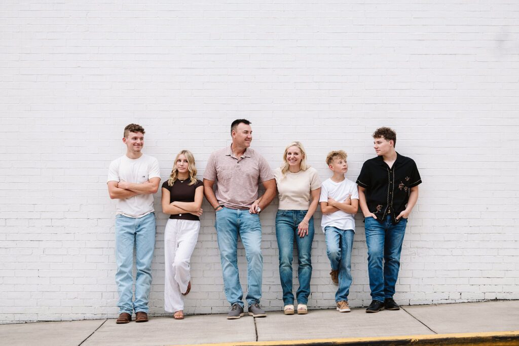 portrait of family near brick wall in Mt. Lebanon, PA