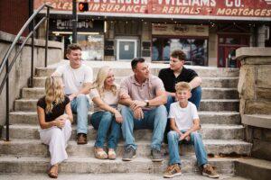 portrait of family sitting on steps in Mt. Lebanon, PA