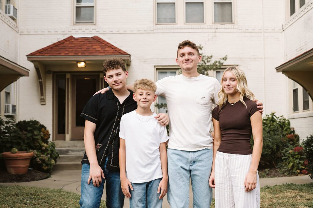 portrait of four siblings laughing in Mt. Lebanon
