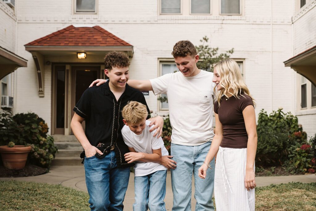 portrait of four siblings laughing in Mt. Lebanon