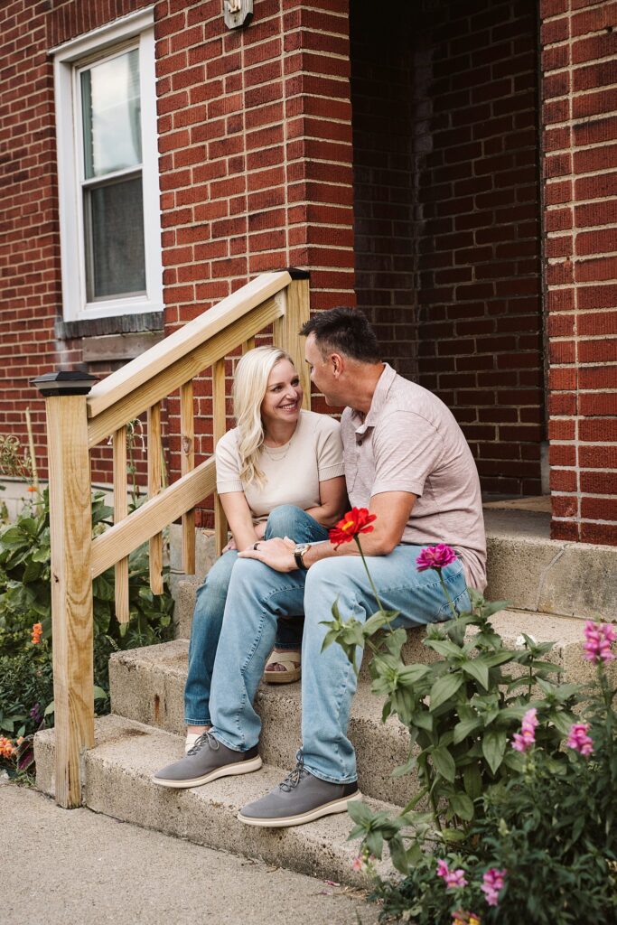 portrait of couple in front of brick porch in Mt. Lebanon, PA