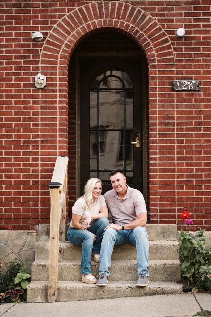 portrait of couple in front of brick porch in Mt. Lebanon, PA