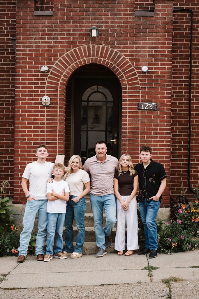 portrait of family in front of brick porch in Mt. Lebanon, PA