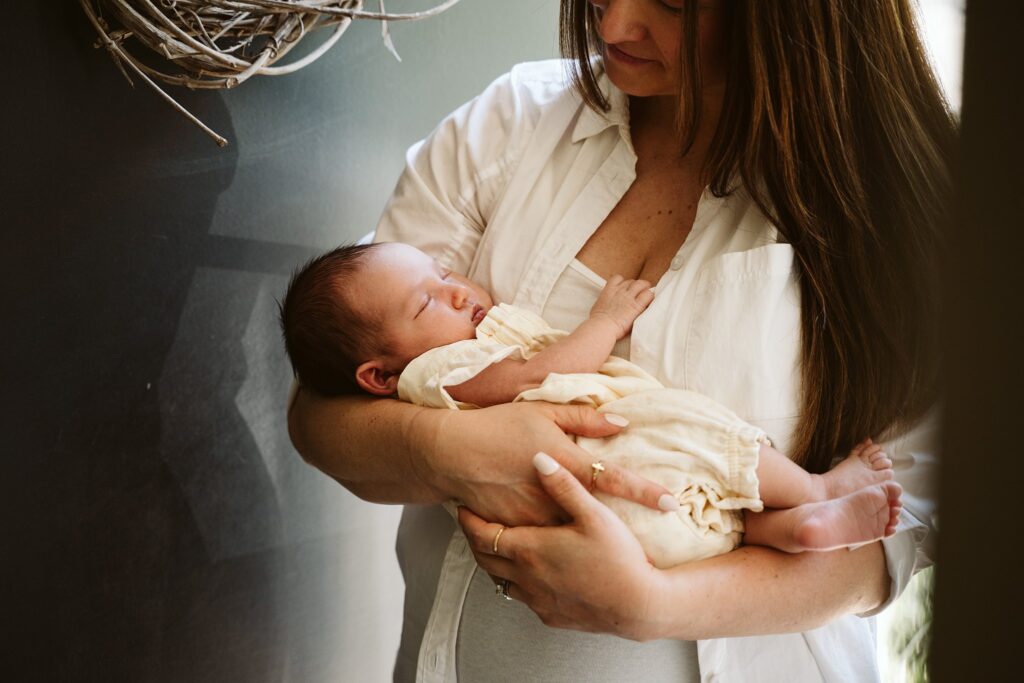 newborn lifestyle photo of mother and baby