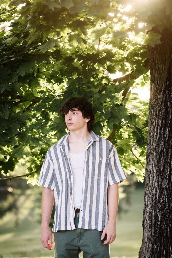 senior guy portraits at golden hour in rural setting