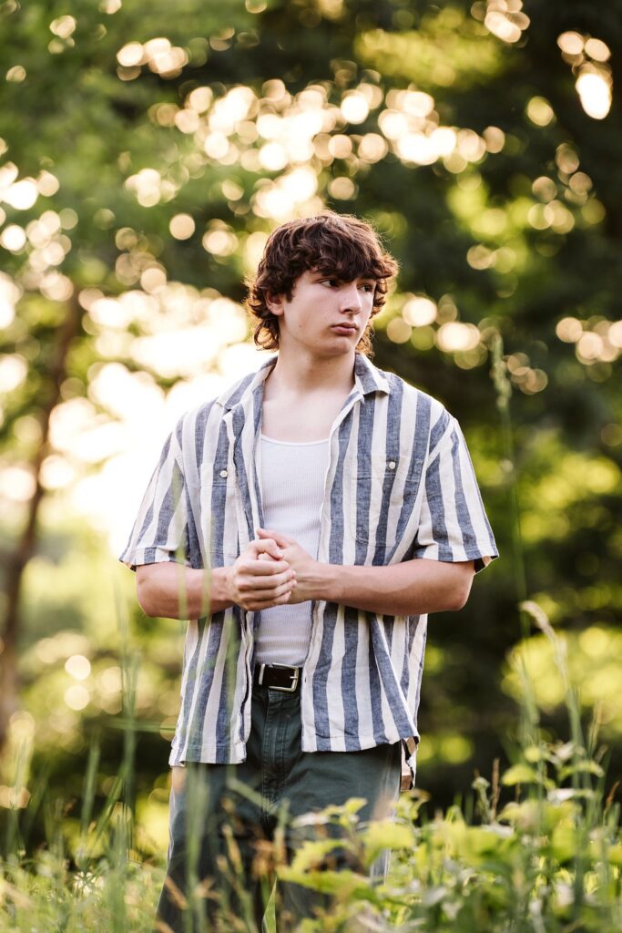 senior guy portraits at golden hour in rural setting
