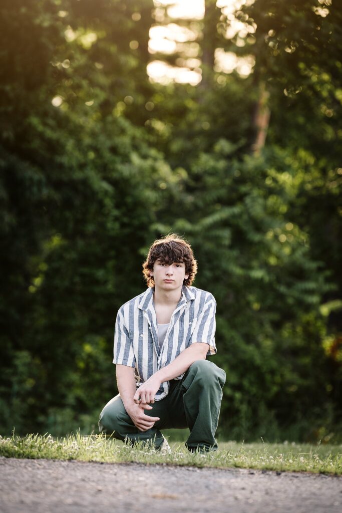 senior guy portraits at golden hour in rural setting