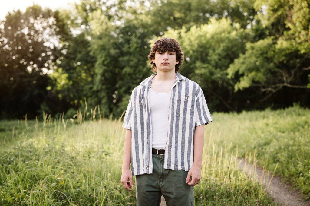 senior guy portraits at golden hour in rural setting