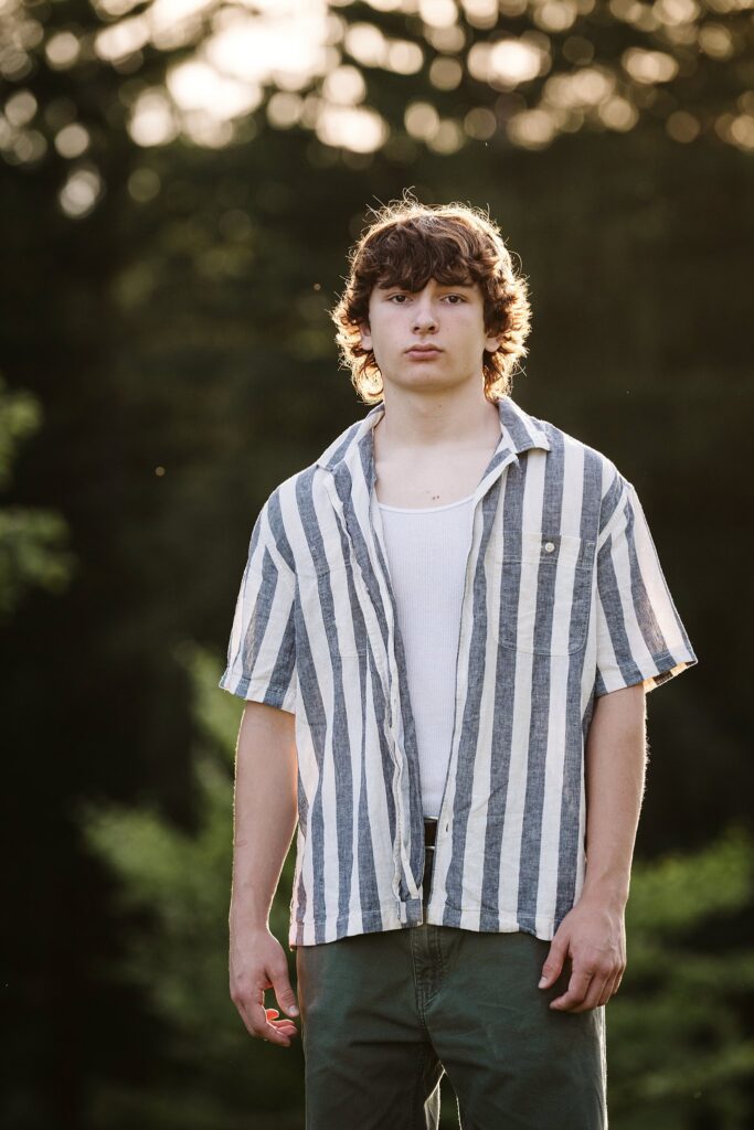 senior guy portraits at golden hour in rural setting