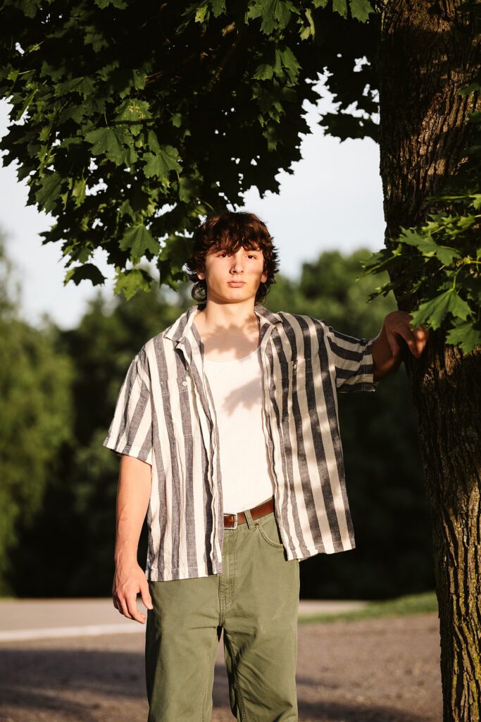 senior guy portraits at golden hour in rural setting