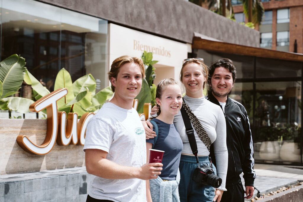 family outside Juan Valdez in bogota
