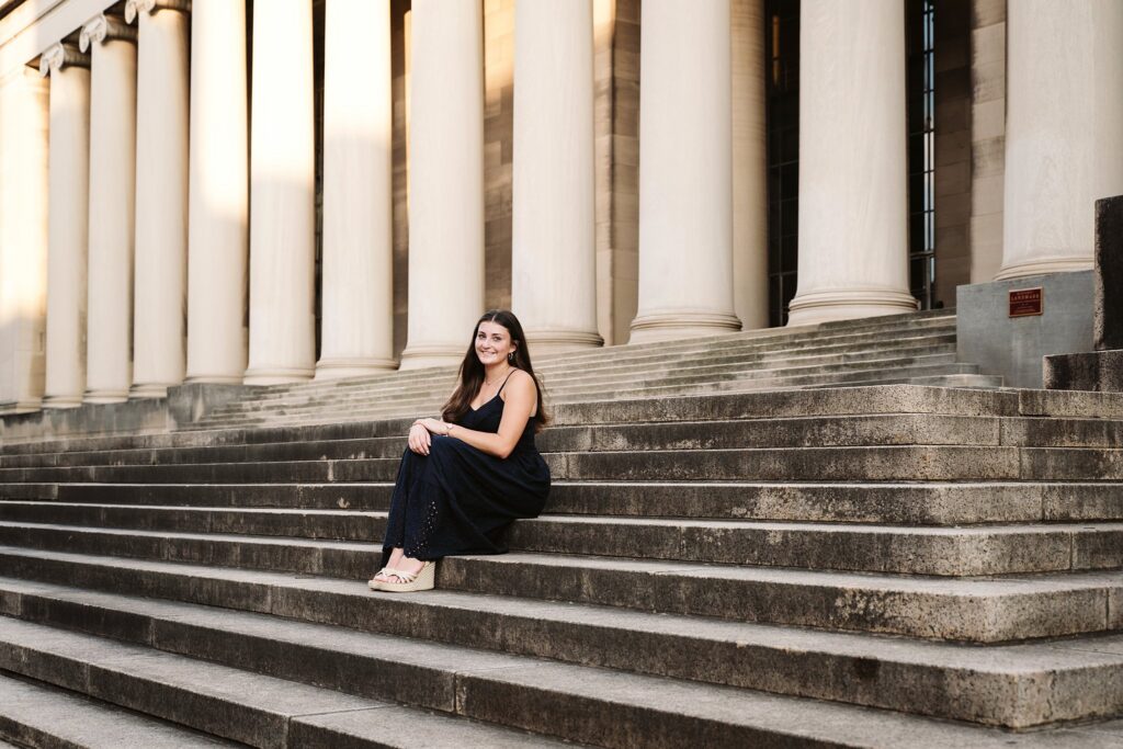 senior girl sitting on steps at the Mellon Institute in Oakland, near Pittsburgh, PA