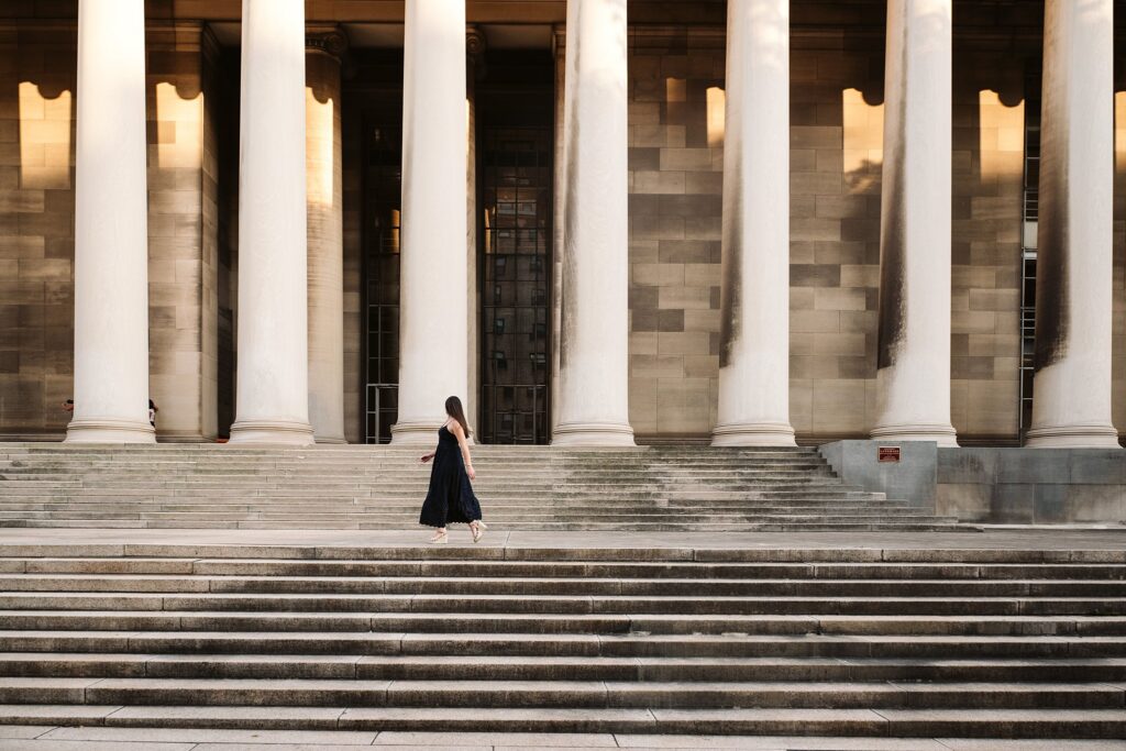 senior girl walking on steps at the Mellon Institute in Oakland, near Pittsburgh, PA