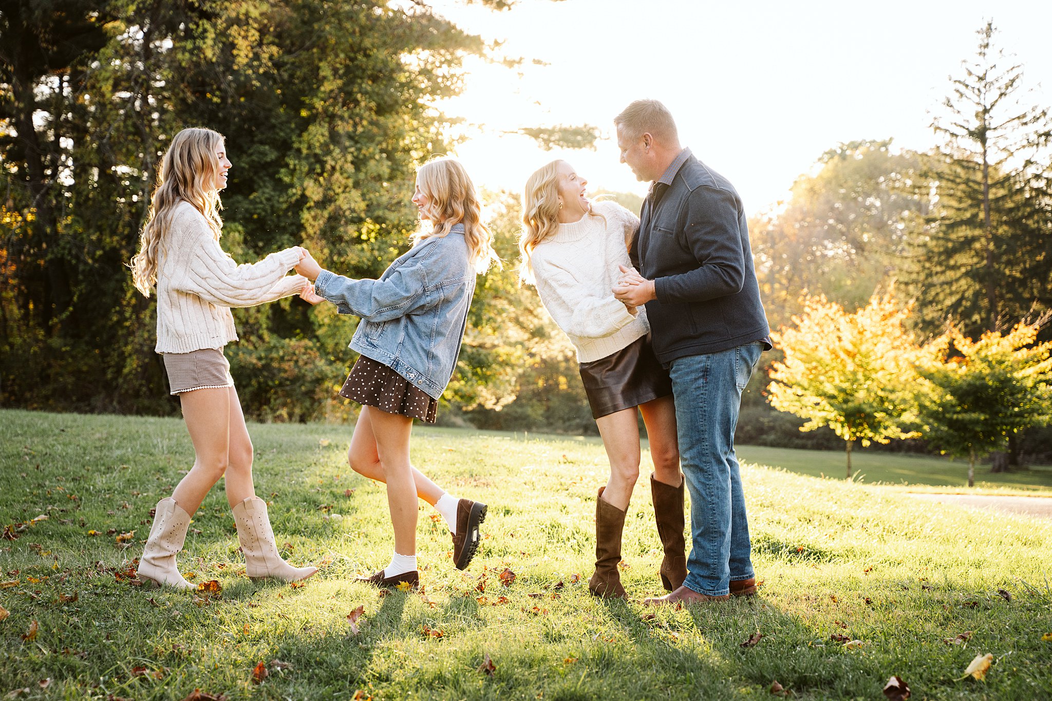 Family dancing together during an outdoor family photography session near Pittsburgh