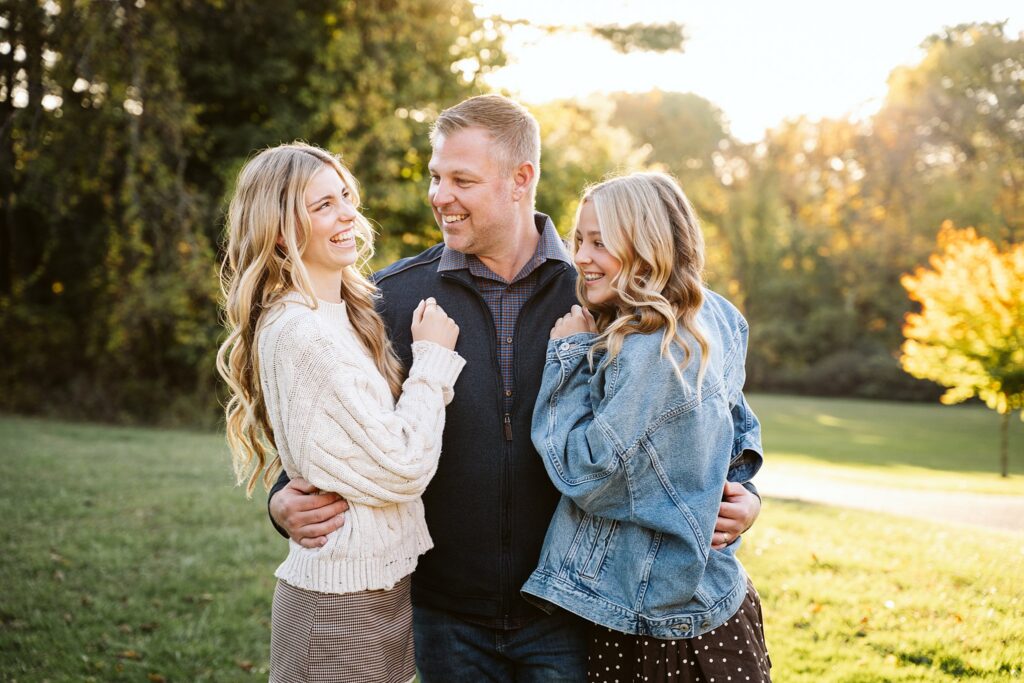 Father hugging his daughters during an outdoor family photography session in Pittsburgh