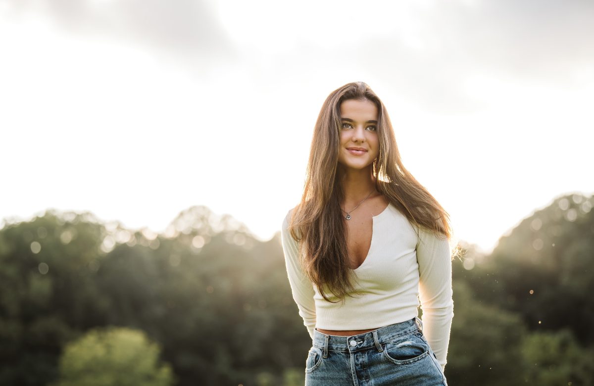 Senior portrait captured in rolling hills at sunset near Pittsburgh, PA